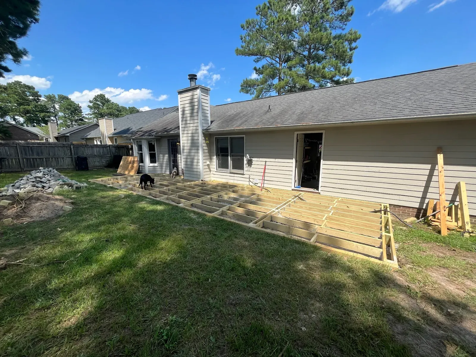 Wide view of deck framing during construction
