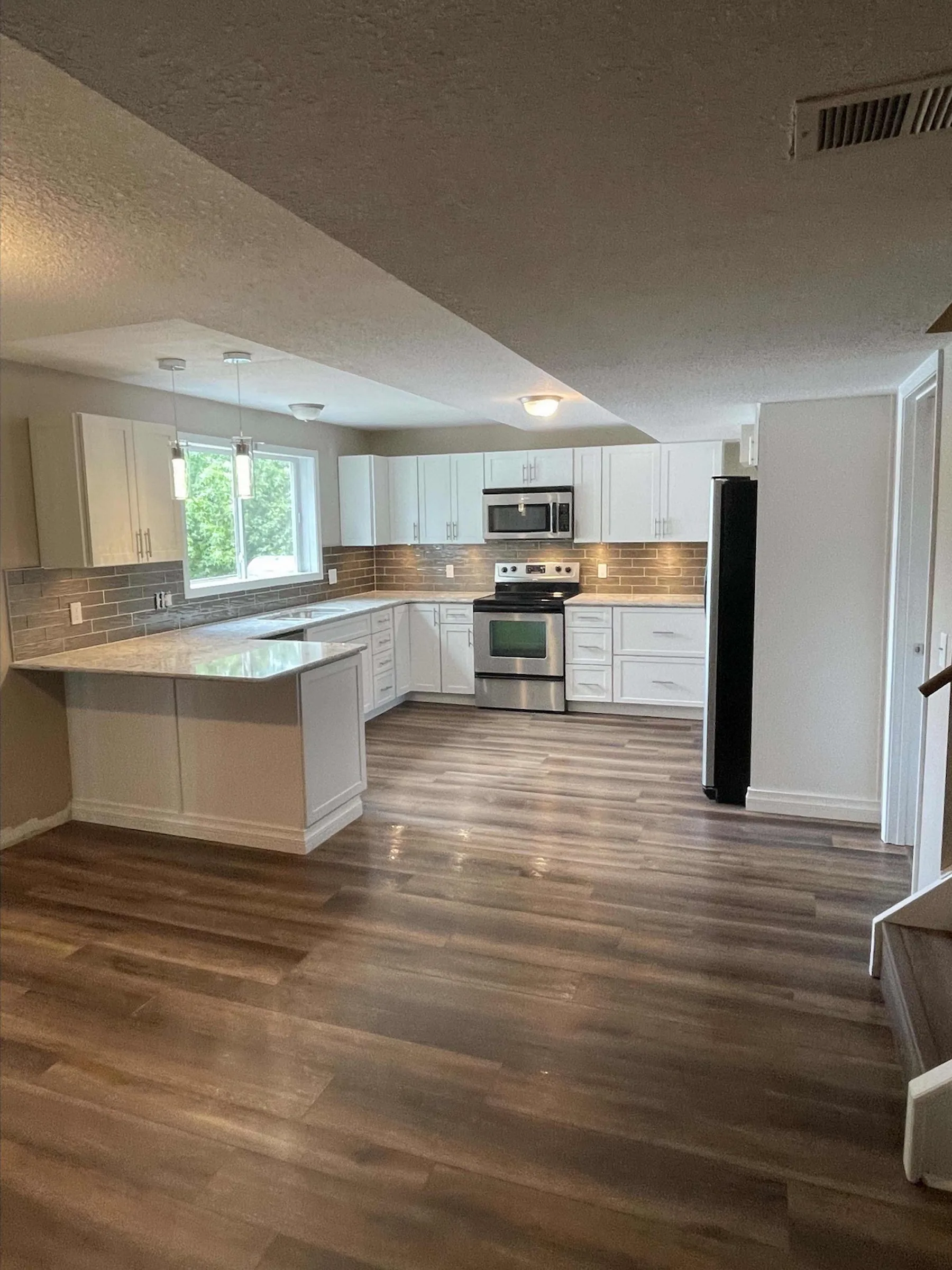 Modern white kitchen remodel with open layout