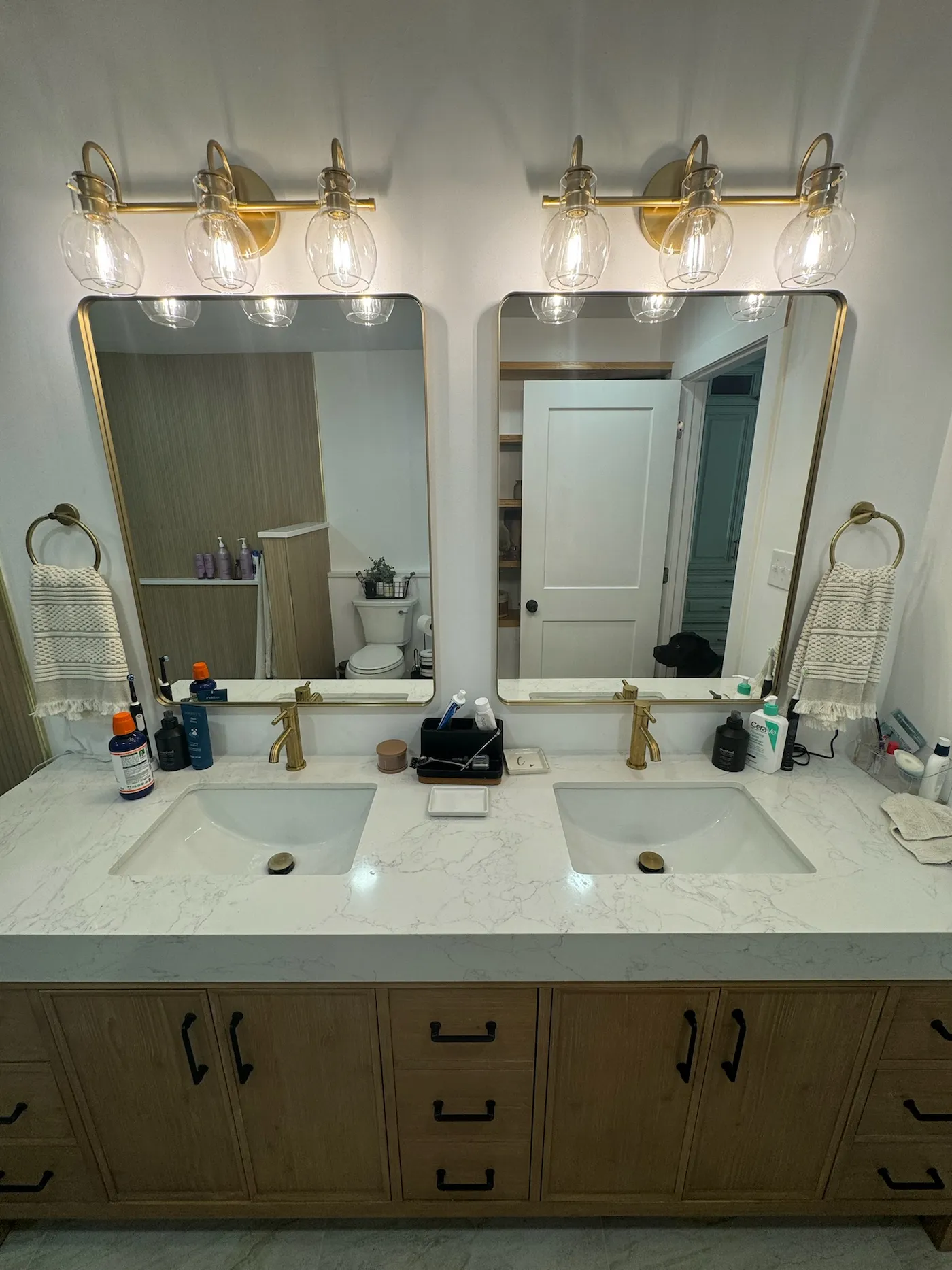 Double vanity with brass fixtures